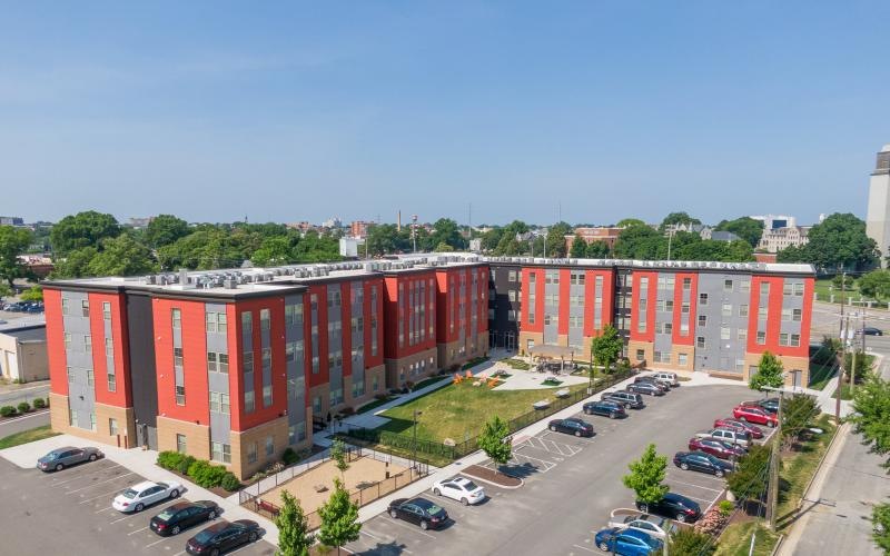 a parking lot with cars and buildings